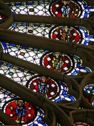 Window w121 depicting bishops, kings, martyrs in a section of the rose window