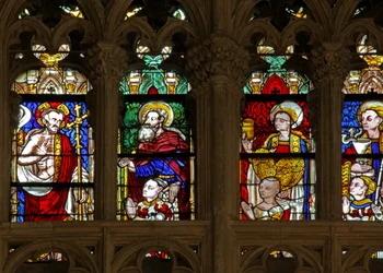Window depicting the risen Christ with donors and their patron saints