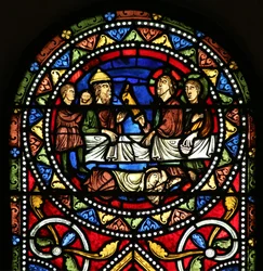 Window depicting the Charity of St Nicholas. He pays for a sick man