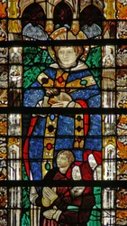 Window depicting St Séverin and a family of donors