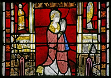 Window depicting a donor priest; architectural border