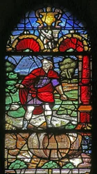 Window depicting a scene of wine-making