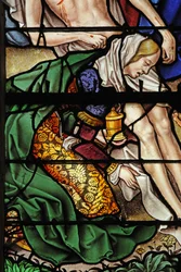 Window depicting a scene from the life of St Mary Magdalene - the saint at the Descent from the Cross