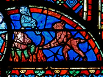 Window depicting an impenitent being tormented by demons