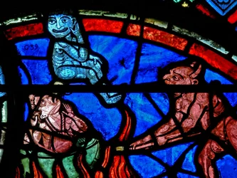 Window depicting an impenitent being tormented by demons