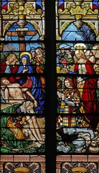 Window depicting the Descent from Cross with the donor Francois de Montmorency and Ste Francoise