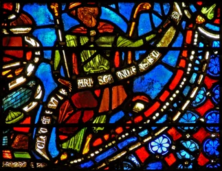 Window depicting the Pharaoh holding a banderole with the words I Clement of Chartres made this window (in the Joseph window)