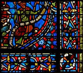 Window depicting the Pharaoh holding a banderole with the words I Clement of Chartres made this window (in the Joseph window)