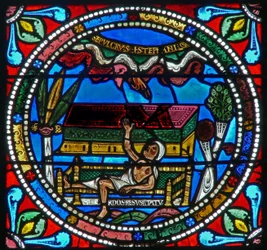 Window wXVII depicting a priest - resurrecting