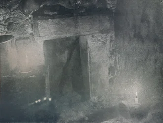 Inside Door of Igloo by Light of Blubber Lamps