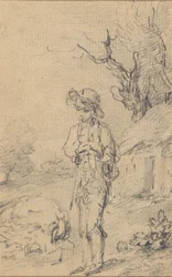 Boy standing by a cottage