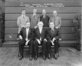 Charles Taze Russell with Ernest Wilson V. Kuehn, General William P. Hall, Robert B. Maxwell, J.T.D. Pyles, Dr. Leslie W. Jones, Professor F.B. Thompson