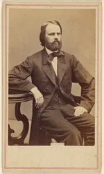 [Unidentified seated man with full beard]
