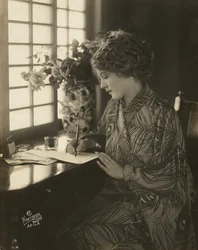 Mary Pickford, Wearing a Kimono, Writing at a Desk, c.1918