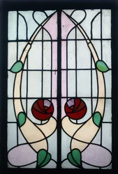 A stained glass panel depicting stylised roses