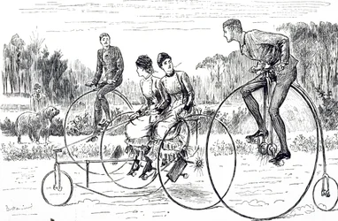 A group of young people riding tricycles