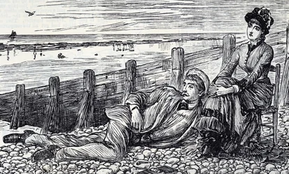 A couple enjoying their honeymoon on a pebbled beach