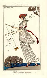 Woman in dress of printed linen playing diabolo