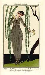 Woman in grey taffeta dress with linen collar and cuffs, satin gilet with enamel buttons, under a willow tree