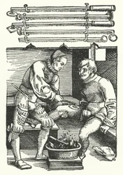 A surgeon cauterising a soldier