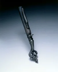 Combined wheel-lock spanner and powder measure