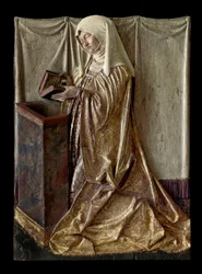 Kneeling donor Fragment of a carved altarpiece in polychrome wood. From Swabia. 1520 approx. Paris, Louvre Museum