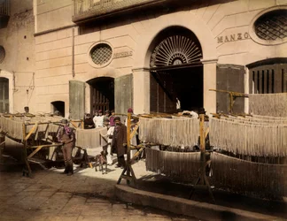 Rows of maccheroni dryers in front of a factory in Torre Annunziata