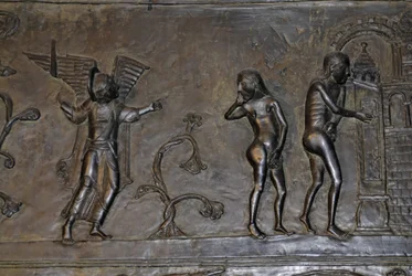 Ottonian Art: Adam and Eve expelled from Paradise. Around 1015. Sculpture on one of the bronze doors of the Cathedral Saint Mary in Hildesheim (Germany).