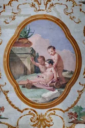 Guest Lodgings, the Room of the Putti, Medallion with Putti: "Three Putti and a Cart"