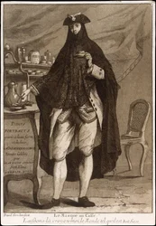 A man wearing a mask drinking a cup of coffee
