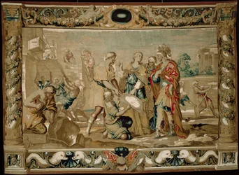 Dido shows Aeneas the plans for the fortifications of Carthage