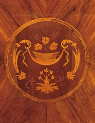 Detail from the side of a north Italian tulipwood, rosewood, fruitwood and marquetry commode