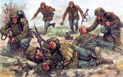 Second World War: soldiers of the Sturmtruppen, an elite unit of the German Imperial Army, one of them cuts barbed wire