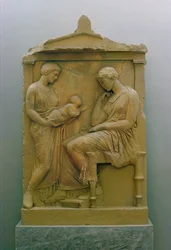 Funerary stela depicting a maid holding a baby out to a seated woman