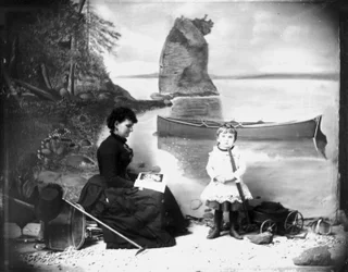 Hannah Maynard and a Small Girl with Her Wagon