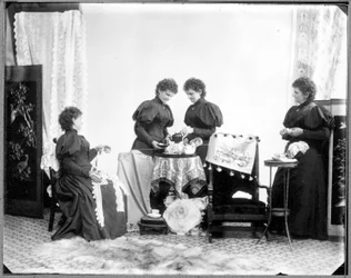Multiple Exposure of Hannah Maynard - Two Having Tea, One Holding a Skein of Cotton, One Taking it Up into a Ball