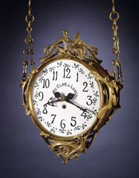 A double-dialed hanging clock