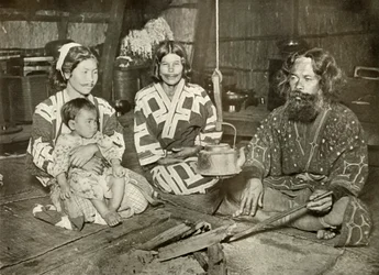 Ainu Man and Women at Home