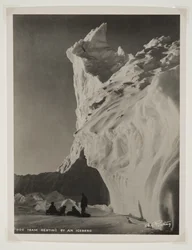 Dog Team Resting by an Iceberg