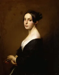 Portrait of a lady, half length, wearing a black dress and holding a carnation