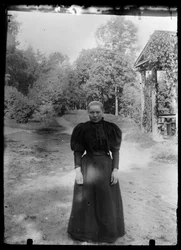 Woman in the Yard of the White Villa