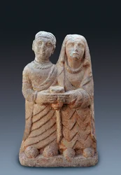 Couple bringing an offering