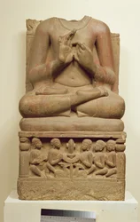Carving of Buddha in the attitude of preaching a sermon