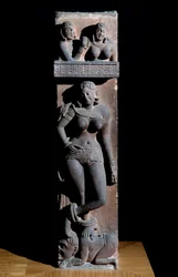 Hinduism: representation of a Yakshini spirit of nature, with a parrot, she stands on a dwarf. Sculpture by Mathura, sandstone. 2nd century. Calcutta, Indian museum