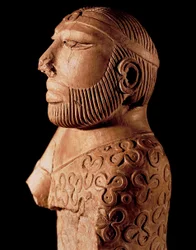 Indus Valley Civilization: wooden bust of a priest-king. Around 2000 BC. From the Mohenjo-Daro site in Pakistan. National Museum of Pakistan, Karachi.