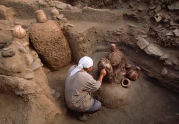 Richard Gomez cleaning newly discovered artifacts at the school dig site
