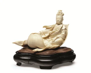 An ivory carving of Kannon floating on a lotus leaf, Meiji period, late 19th century