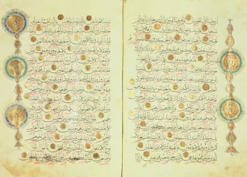 Seljuk style Koran with illuminated sunburst marks and small trees in the margin to aid counting and mark the points for prostration