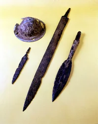 Weapons of a Lombard warrior: shield umbrella, dagger, sword and spear tip