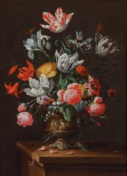 Tulips and Other Flowers in a Painted Stoneware Baroque Vase on a Wooden Ledge
